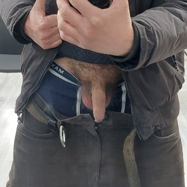 A beautiful, thick cock with full balls is on full display in this casual pic.