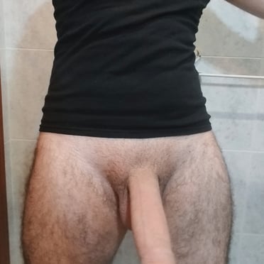 A beautiful 8-inch thick cock with hairy thighs from a muscled dude, hot pic.
