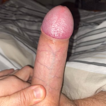 A beautiful, thick, veiny cock with a hint of pubic hair is featured in this pic.
