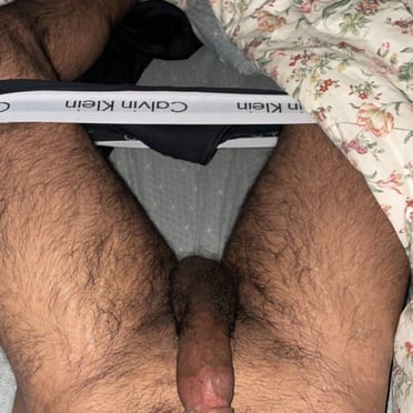 Juicy, thick dick with a hairy bush, a muscled stud's pic.