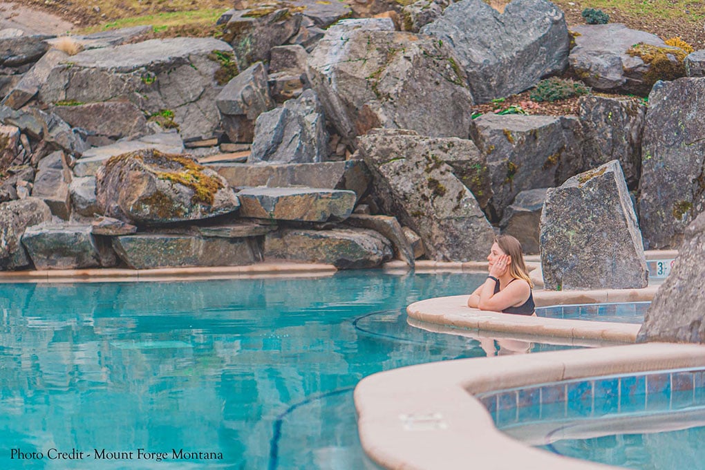 A person relaxing in Quinns Hot Springs