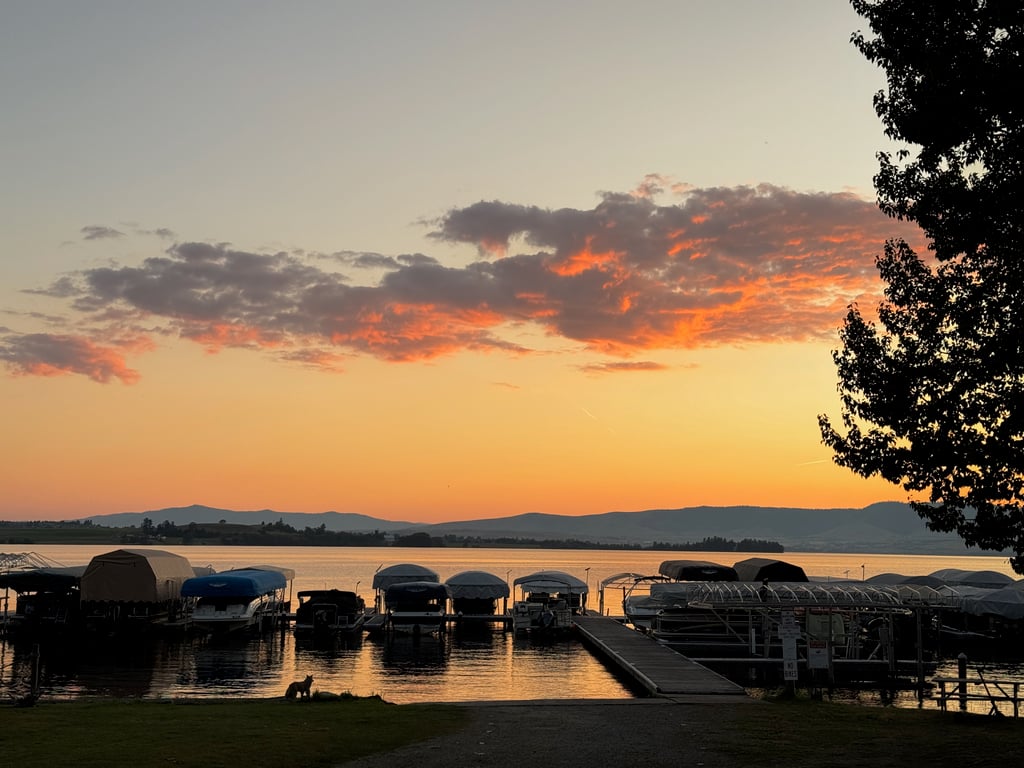 Sunset over boat dock in Polson marina