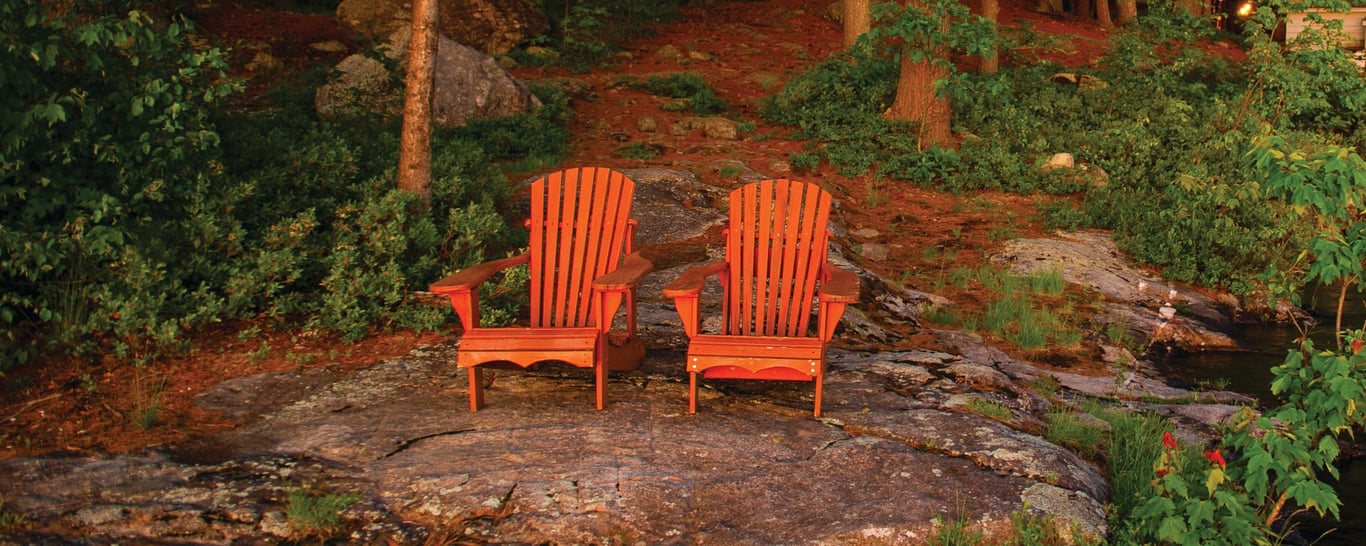 two chairs near a stream