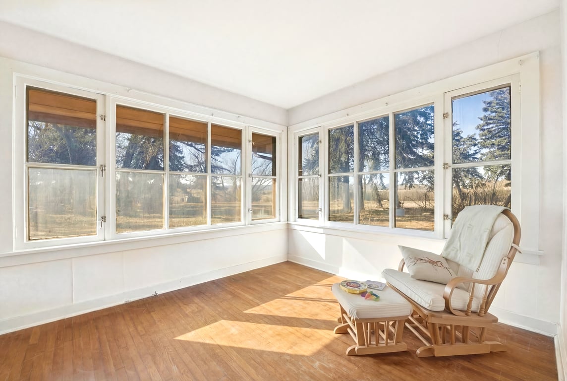 Sunroom with large windows overlooking the property at 122122 Nissler Road near Butte, Montana