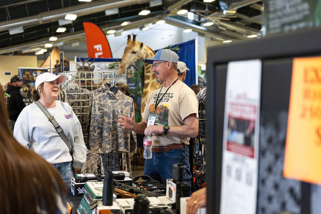 Attendees at exhibitor booth