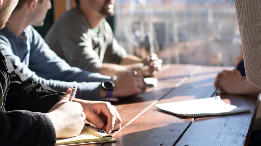 Image of several people in a meeting