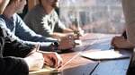 Image of several people in a meeting