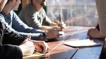 Image of several people in a meeting