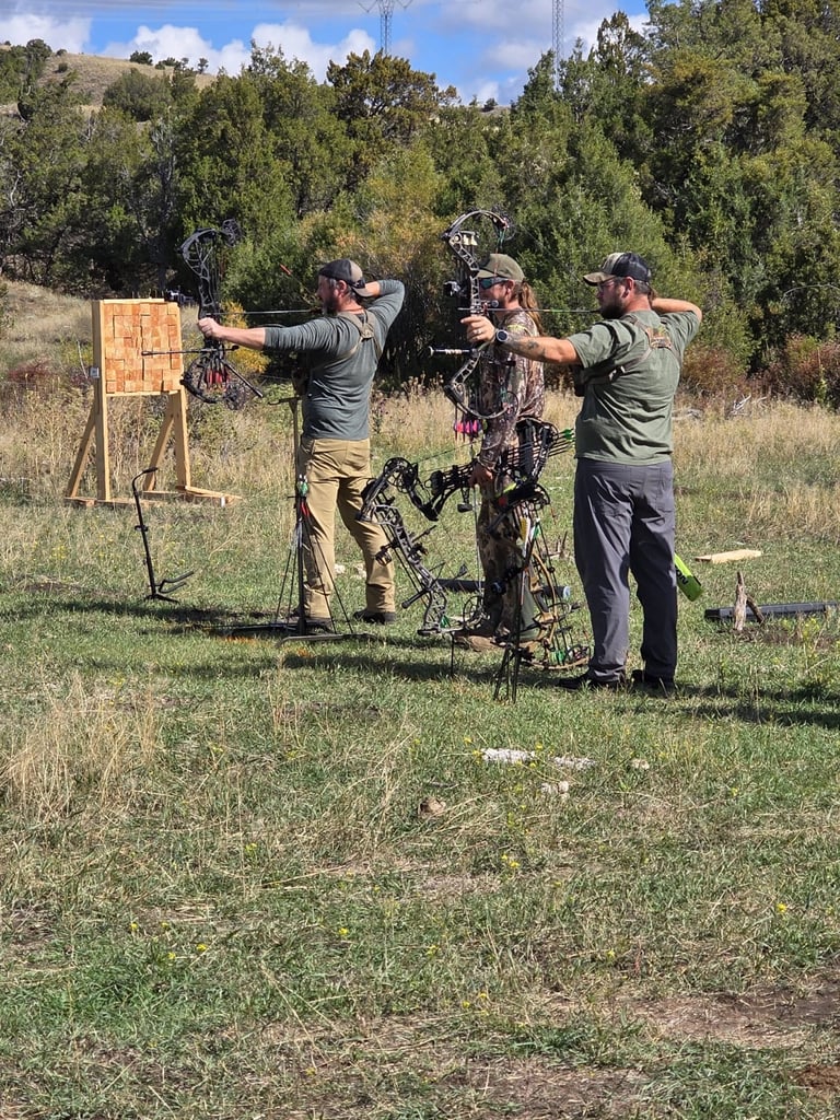 Participants practicing archery together