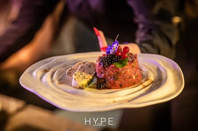 Beautifully presented tartare dish with caviar and garnish