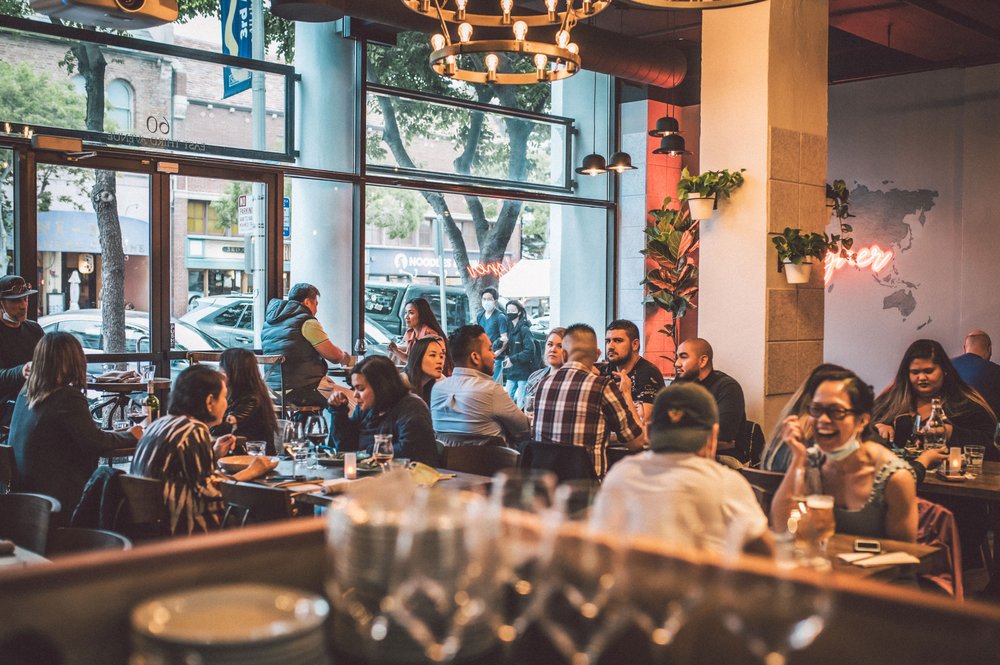 Foreigner Cafe interior with warm lighting and international cuisine