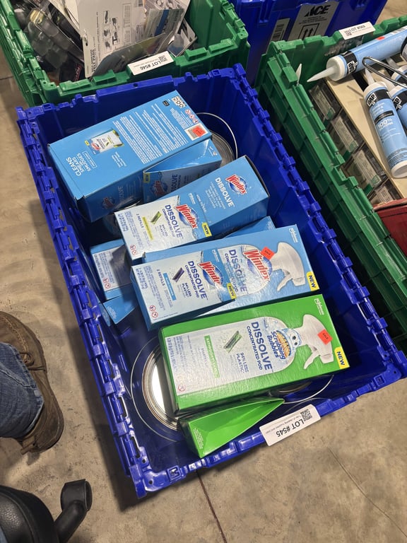 Tote of cleaning supplies and stain