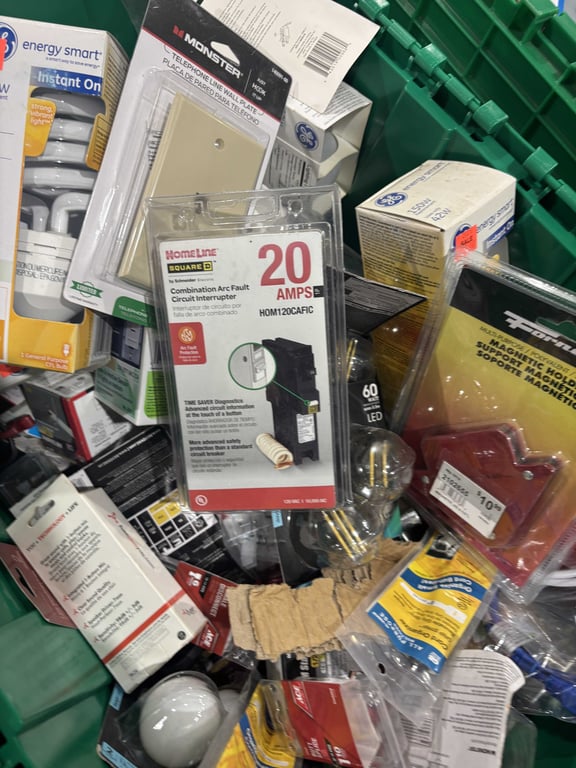 Tote of light bulbs, outlet covers, headphones, misc electrical  - Image 3