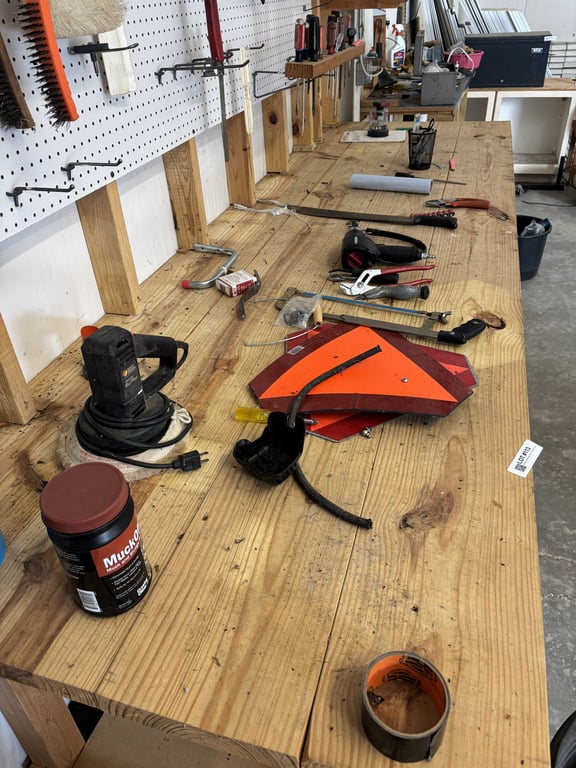 Contents of Wood Table Top and Pegboard Above