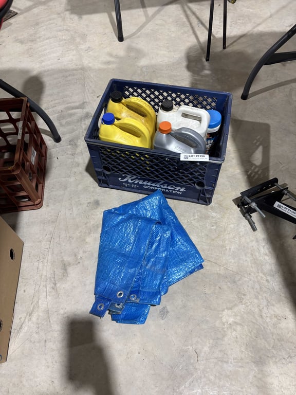 Tote of antifreeze, cleaner, tarp