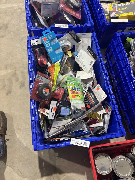 Tote of toilet flappers, spackling, toilet connectors, telephone line, extension cord, misc