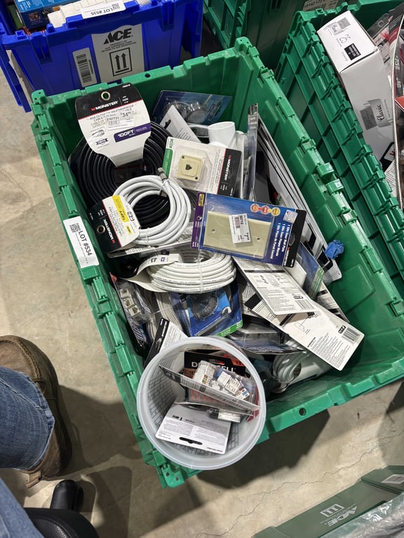 Tote of coax cable, switch covers, PVC fittings, batteries, misc