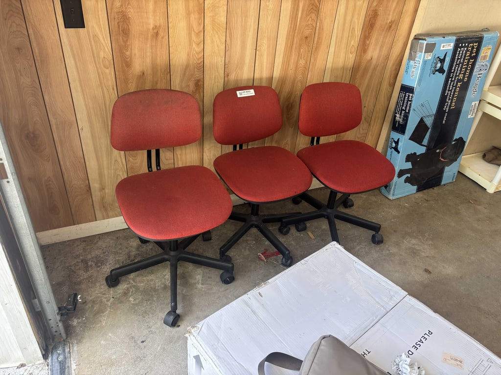 3 red rolling chairs
