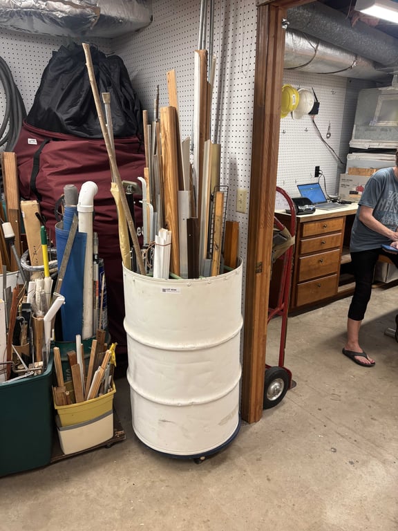 Large divided barrel with misc wood