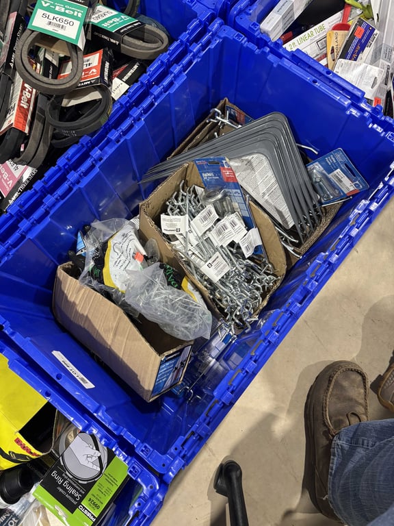 Tote of pegboard hooks, t post clips, tool hangers, etc