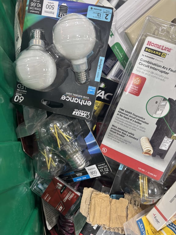 Tote of light bulbs, outlet covers, headphones, misc electrical  - Image 5