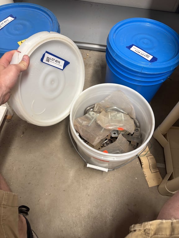 Bucket of misc U bolts and muffler clamps