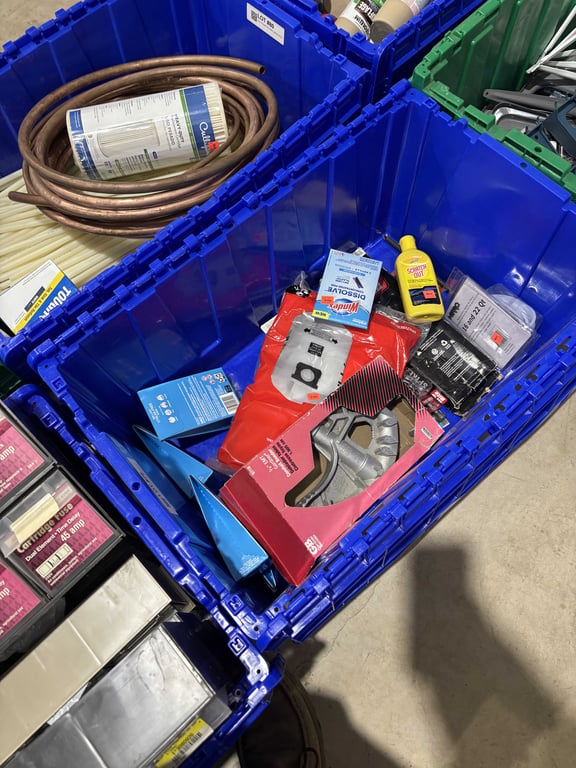 Tote with conduit bender, filters, gaskets, misc