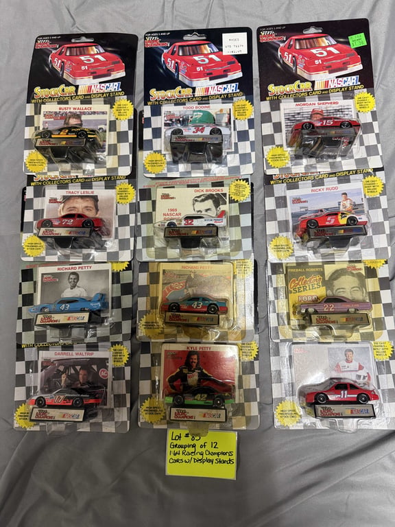 GROUPING OF 12 1:64 RACING CHAMPION CARS W/DISPLAY STANDS