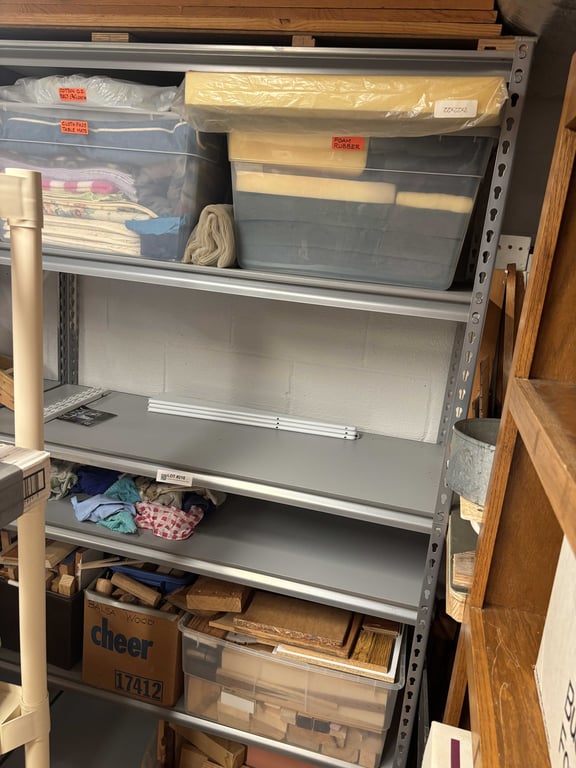 Contents of 3rd metal shelf & wood contents in corner