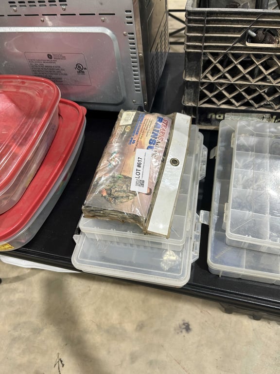 2 containers of fishing lures and 1 Sterns adult rainsuits