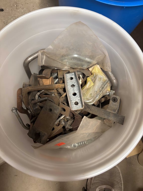 Bucket of misc U bolts and muffler clamps - Image 2