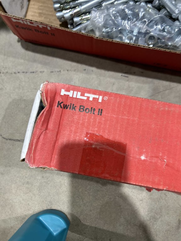 Tote of DAP, plastic shelving, Kwik bolts - Image 4