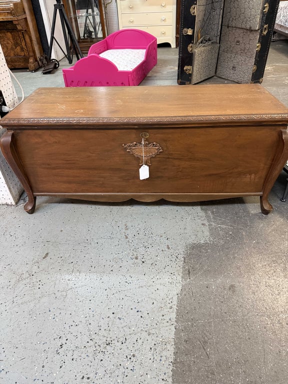 ANTIQUE FOOTED WALNUT CEDAR CHEST