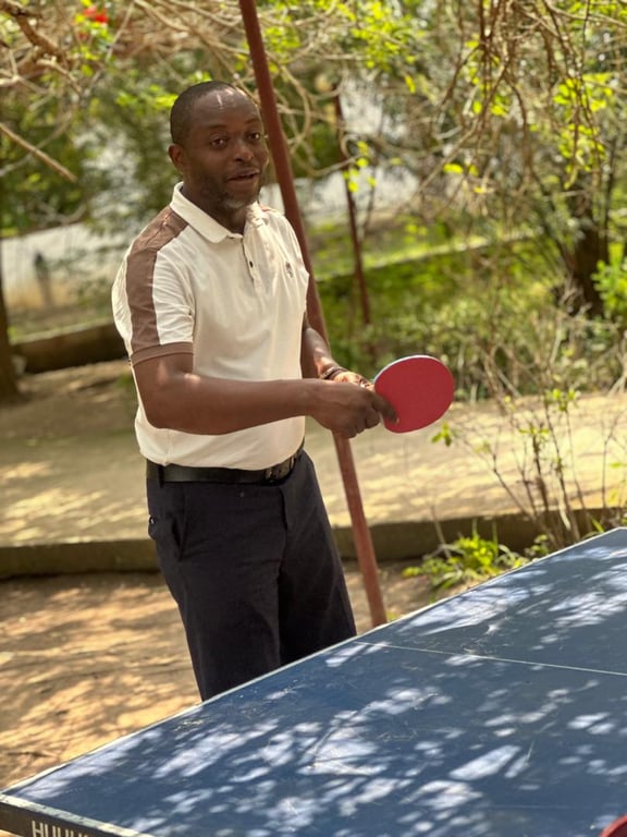 A church member getting ready to serve during a game of table tennis