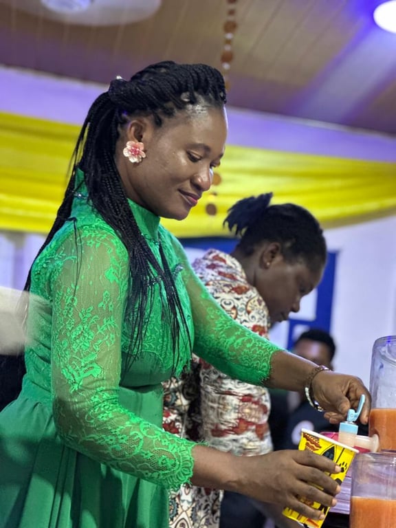 A woman in a green lace dress serving drinks at Counselling 101