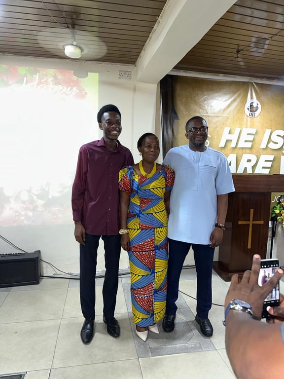 A mother posing with two men in front of the pulpit on Mother’s Day