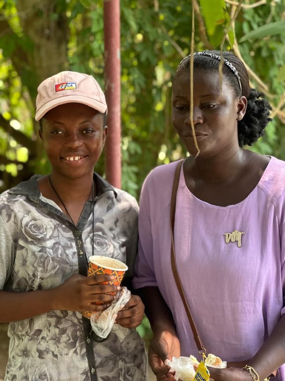 Two women sharing refreshments together at the Love Feast