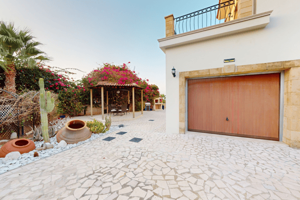 Side elevation with garden storage and trimmed greenery, completing the external amenities.