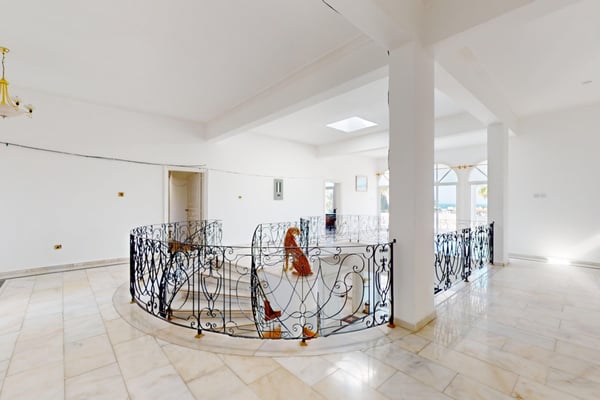 A seamless blend of dining and living space, offering flexibility and sophistication for entertaining guests or unwinding after a day by the pool.