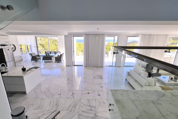 Open layout combining kitchen, dining, and living areas.