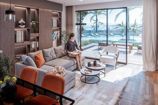 Open-plan kitchen and dining space with sleek cabinetry, modern appliances, and soft lighting for a polished look.