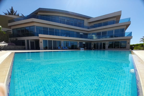 Indulge in luxury with this exclusive villa, featuring breathtaking sea views, a private spa, orchard, and two swimming pools in a prime location.