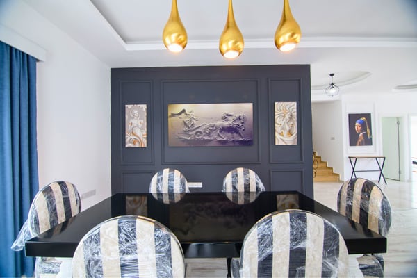 Formal dining area with upscale decorative touches and intimate lighting perfect for elegant dinner settings.