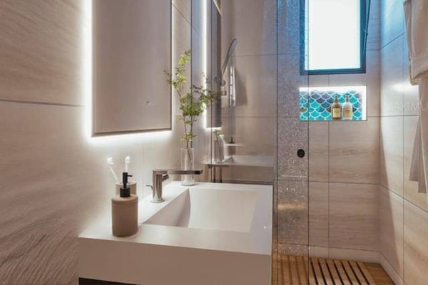 Guest bathroom featuring contemporary vanity and polished finishes that echo the home’s refined look.