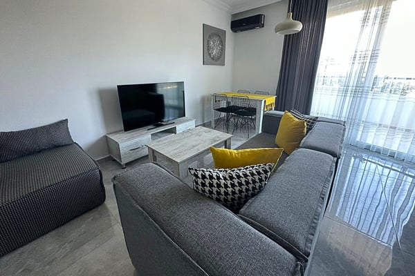 Comfortable and stylish lounge area featuring minimalist decor and a cozy atmosphere.