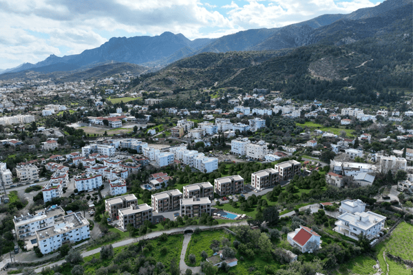 Expansive view under shifting sunlight, enhancing the visual depth and calm ambiance of the residential development.