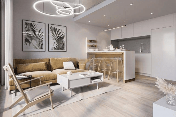 Spacious living-dining area unified by light tones and an open-plan design that enhances natural light flow.