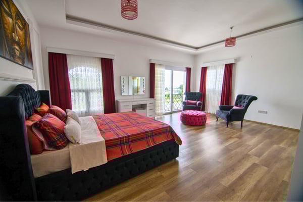 Colorful bedroom with bold decor and bright accents exuding charm and character.