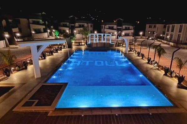 Aerial view of the swimming pool and communal deck, showcasing the upscale living environment.