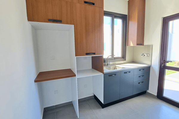 Compact secondary kitchen designed for convenience and modern living.